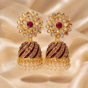 Traditional antique gold jhumka earrings with rainbow crystal floral studs, ruby red center stone, maroon striped dome design and pearl bead hangings by Shining Riva